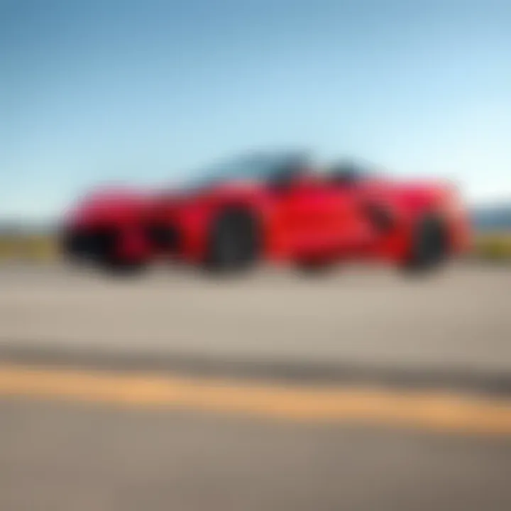 A bright red 2023 Corvette C8 convertible parked, showcasing its sleek design and enhancements, with a for sale sign in the window.