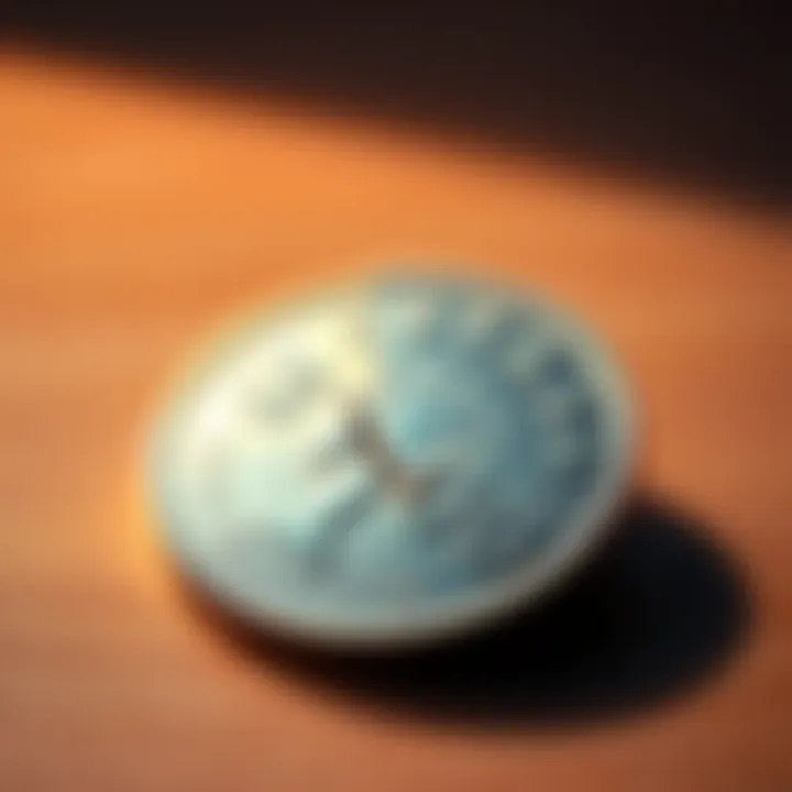 A shiny, partially cut expensive coin lying on a wooden table, with a faint reflection of light.