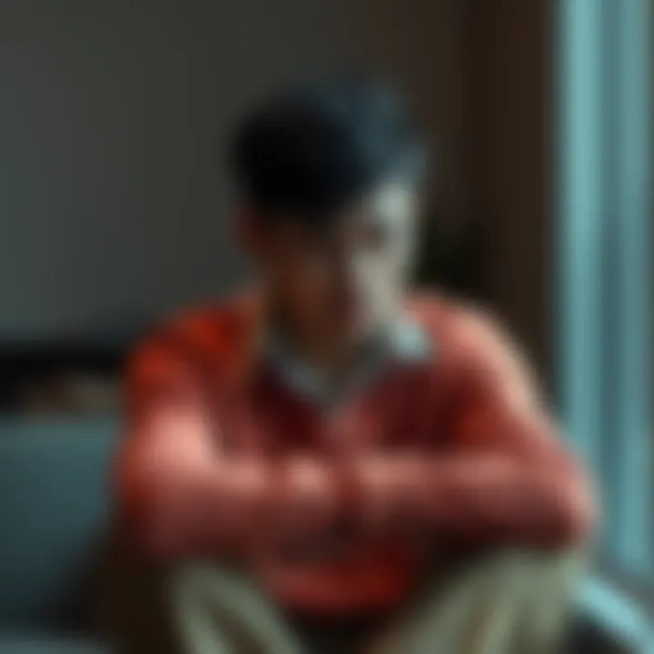 A person sitting with a sad expression, reflecting on unmet expectations